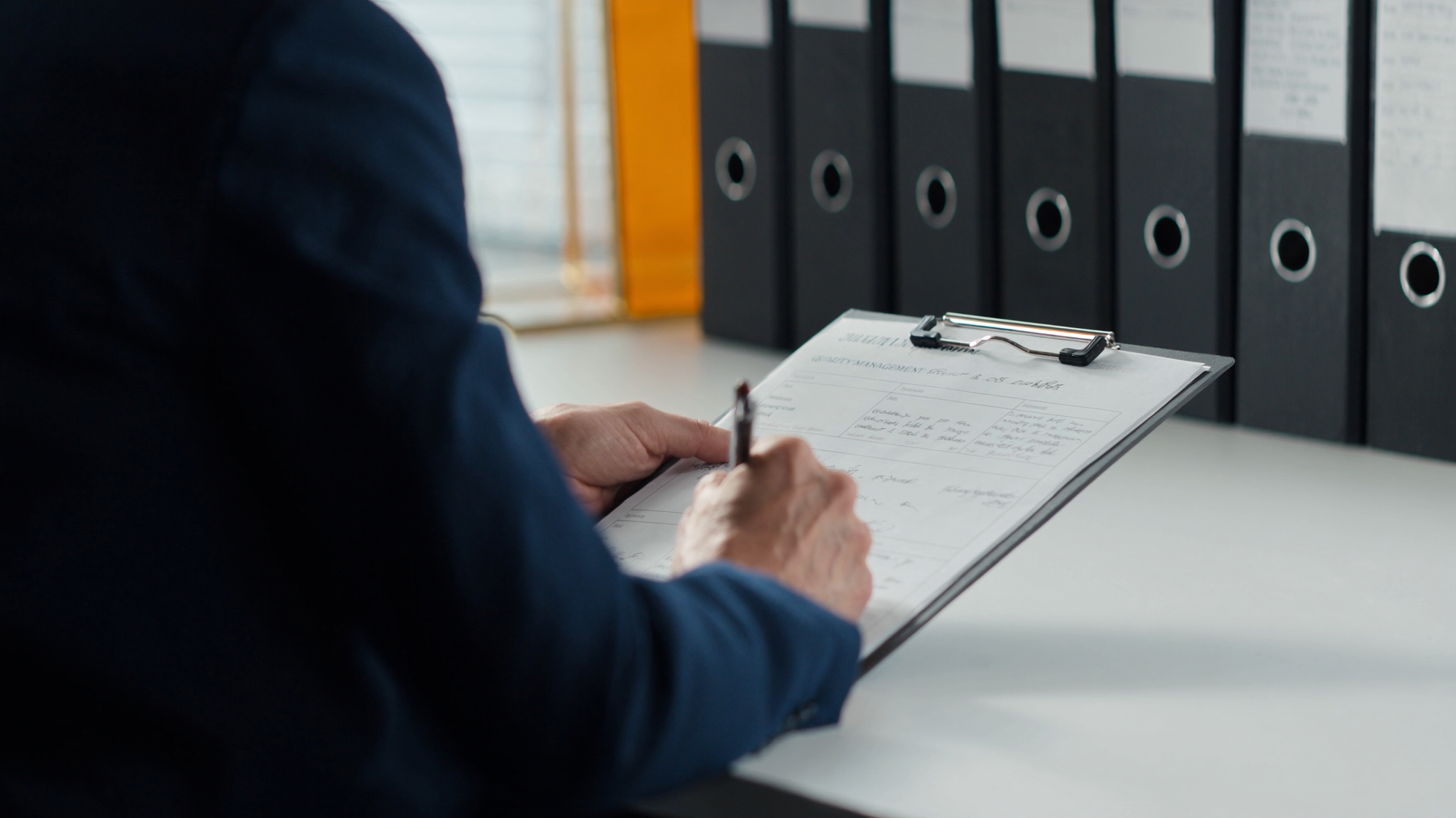 A quality management record being signed off at an Isospeed7 operations desk